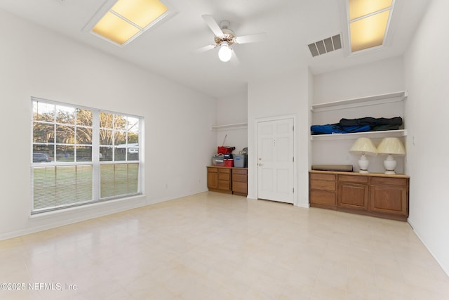 unfurnished bedroom with visible vents, light floors, baseboards, and ceiling fan