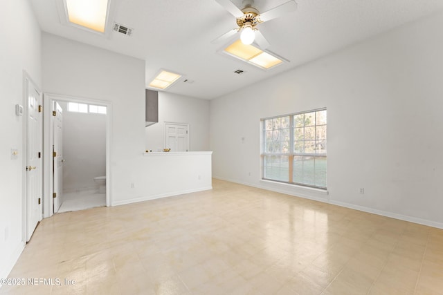 unfurnished living room with visible vents, light floors, baseboards, and ceiling fan