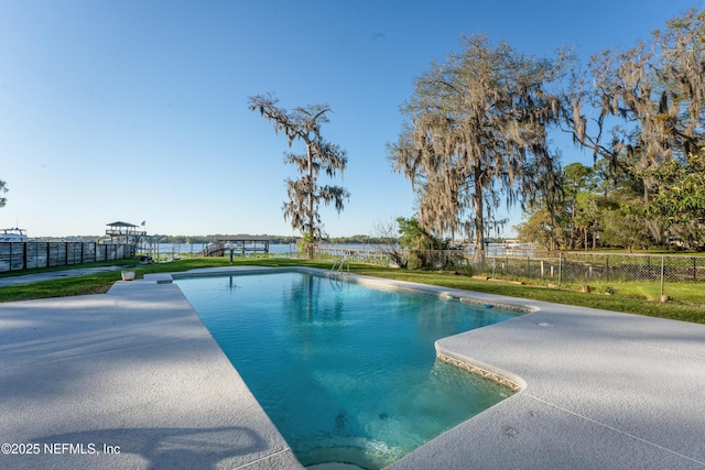 view of swimming pool featuring a fenced in pool, a patio area, and fence