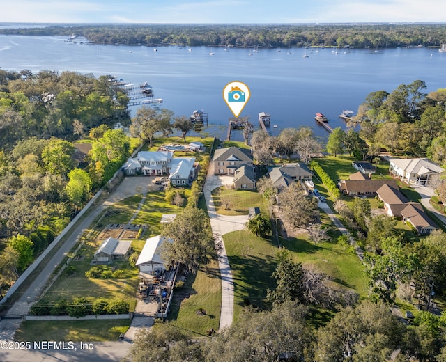 bird's eye view with a residential view and a water view