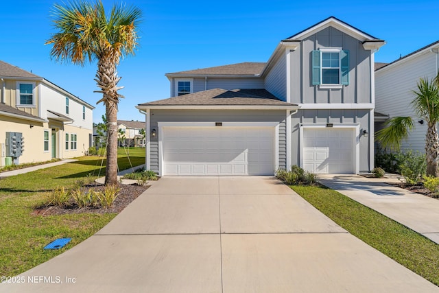 view of front of property with a garage, board and batten siding, concrete driveway, and a front lawn