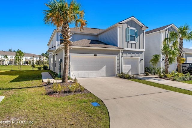 view of front of house with driveway, a residential view, board and batten siding, an attached garage, and a front yard