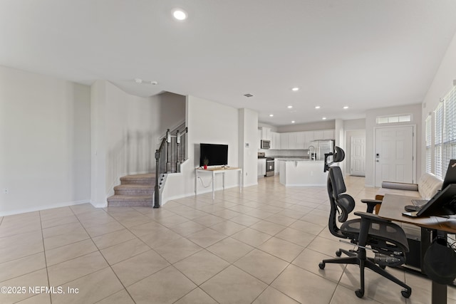 office space featuring light tile patterned floors, recessed lighting, and baseboards