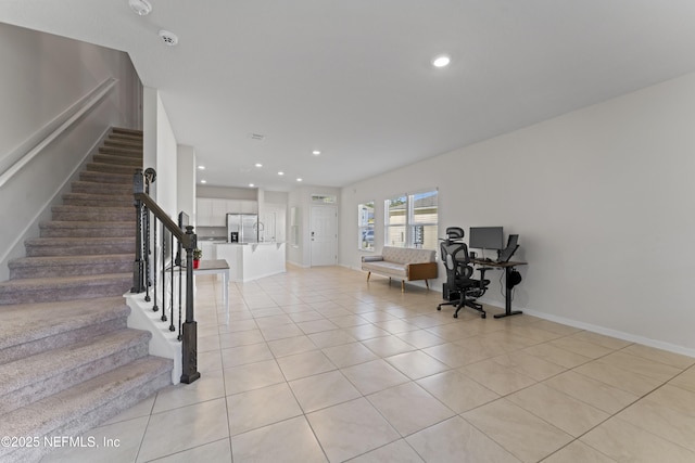 interior space featuring tile patterned floors, recessed lighting, and baseboards