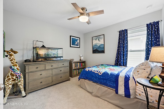 bedroom featuring light carpet and ceiling fan