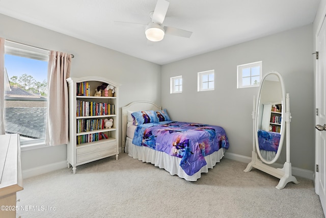 bedroom with carpet flooring, a ceiling fan, and baseboards