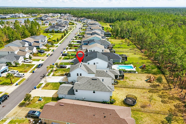 bird's eye view with a view of trees and a residential view