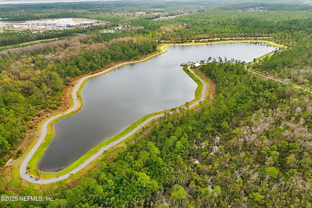 bird's eye view featuring a view of trees and a water view