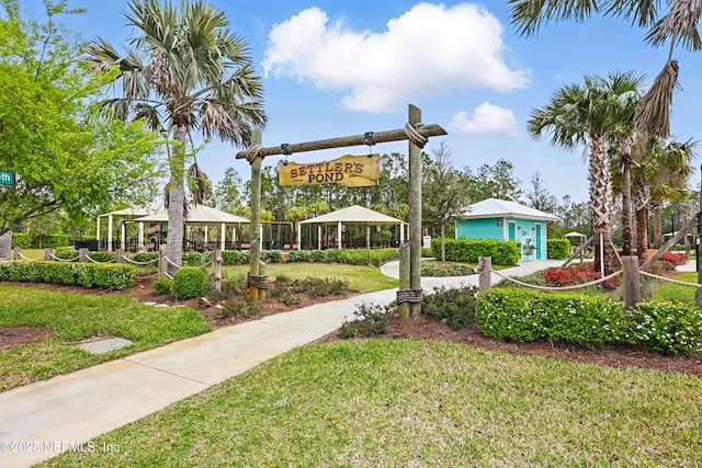 surrounding community with a gazebo and a lawn