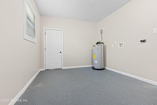 interior space with baseboards and water heater