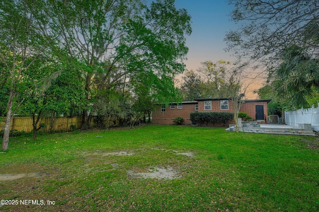 yard at dusk with fence