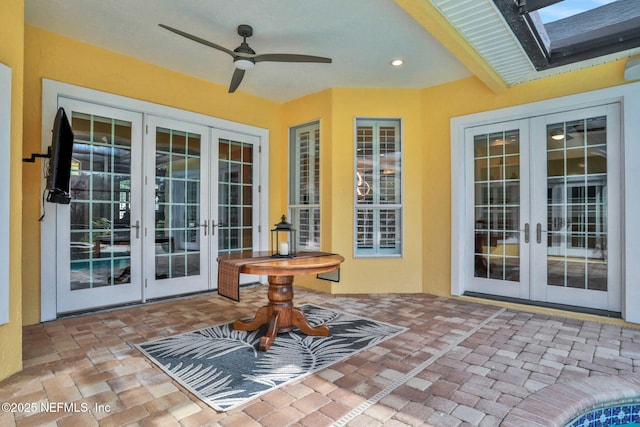 view of patio featuring a ceiling fan and french doors