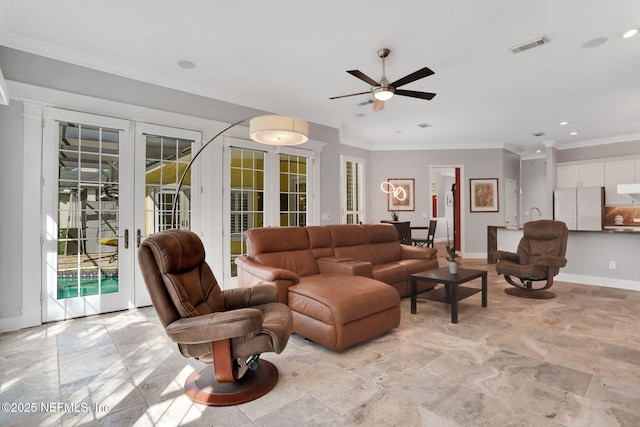 living area with visible vents, baseboards, ornamental molding, french doors, and a wealth of natural light