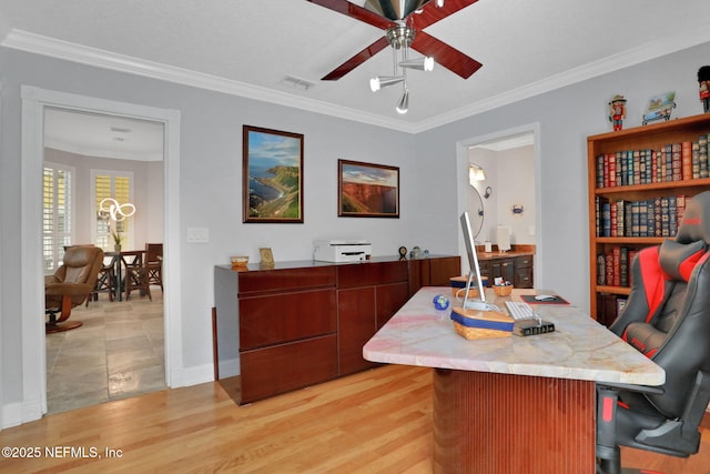 office space with visible vents, light wood-style floors, ceiling fan, and crown molding