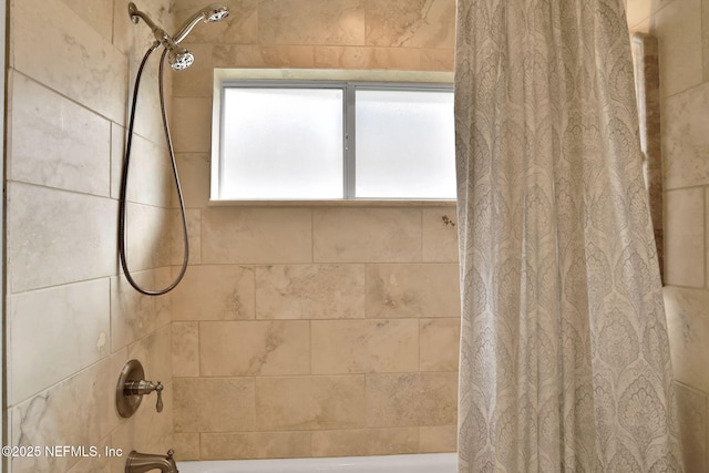 bathroom with shower / tub combo