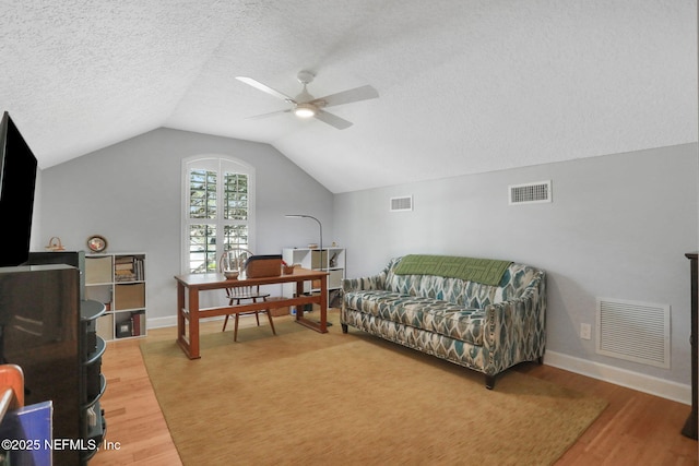 office featuring visible vents and wood finished floors