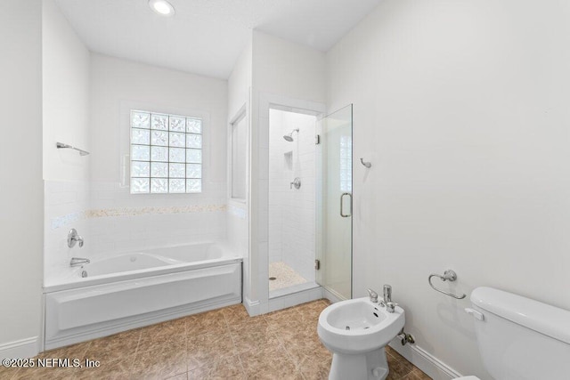 bathroom with a bidet, baseboards, a shower stall, a garden tub, and toilet