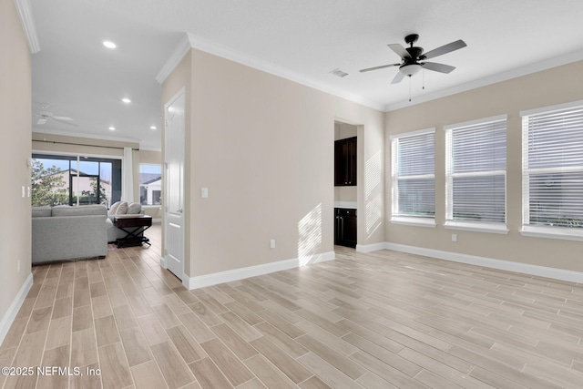 unfurnished living room featuring light wood-type flooring, baseboards, a ceiling fan, and crown molding