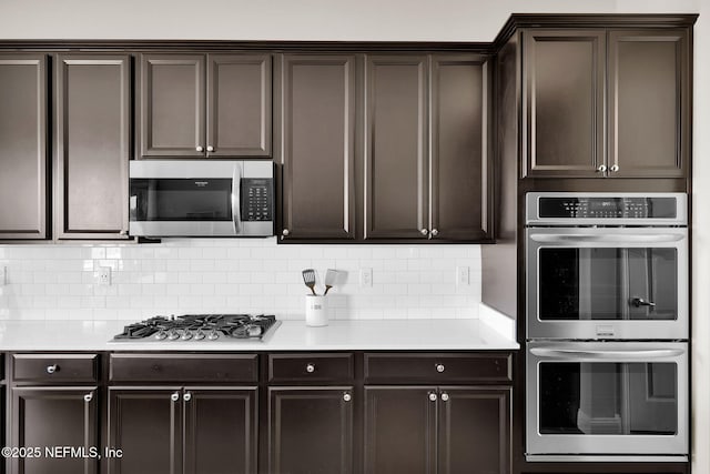 kitchen featuring light countertops, tasteful backsplash, dark brown cabinetry, and stainless steel appliances