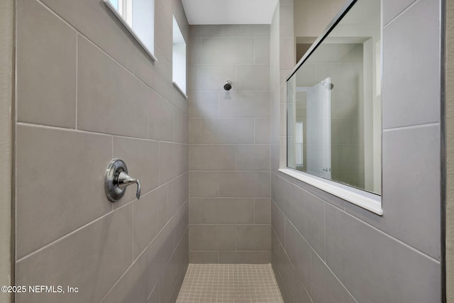 bathroom featuring tiled shower