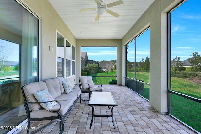 sunroom / solarium with ceiling fan