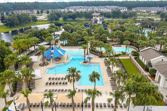 birds eye view of property with a water view