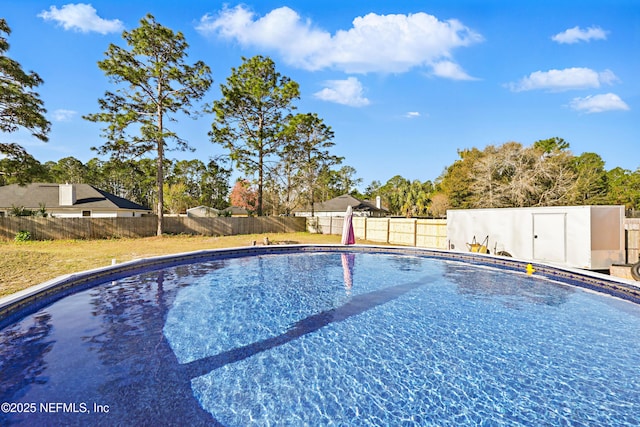 view of pool with a fenced backyard and a fenced in pool