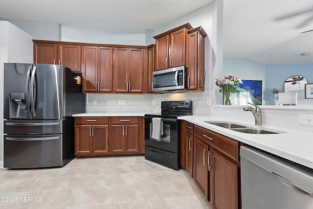 30302 Trophy Trl, Bryceville, FL 32009 - kitchen featuring light countertops, a sink, backsplash, and appliances with stainless steel finishes