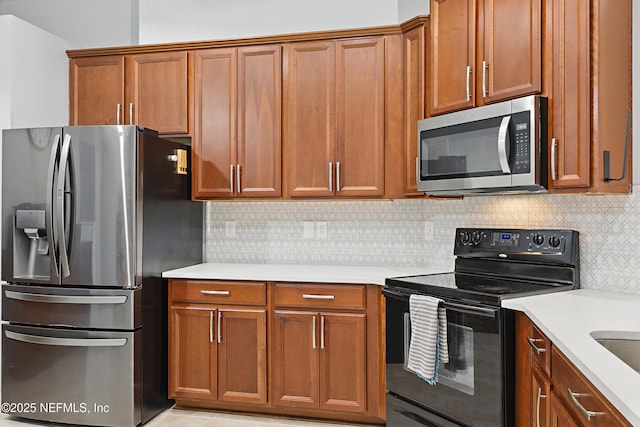 30302 Trophy Trl, Bryceville, FL 32009 - kitchen with light countertops, appliances with stainless steel finishes, and brown cabinets