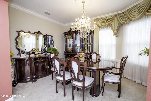 dining area featuring light carpet, a notable chandelier, crown molding, and visible vents