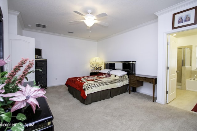 carpeted bedroom featuring ceiling fan, ensuite bath, visible vents, and ornamental molding