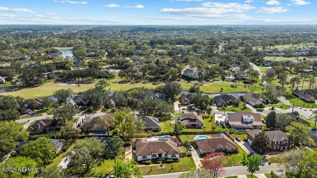 bird's eye view with a residential view and a water view