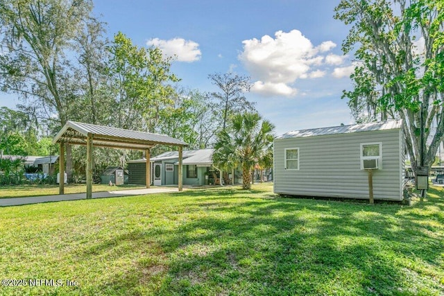 view of yard featuring an outbuilding and a carport