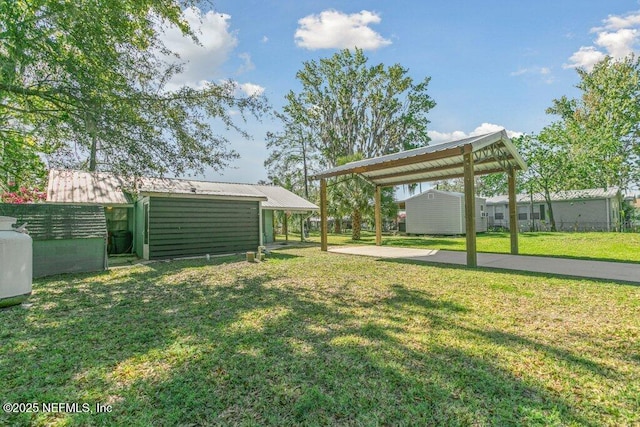 view of yard with an outbuilding and fence