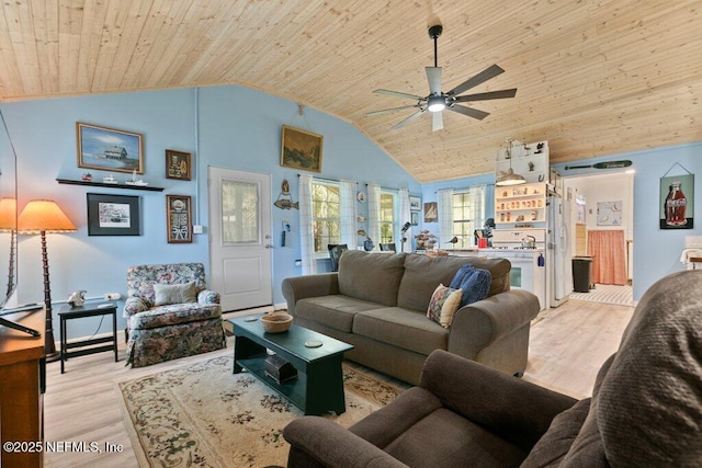 living area featuring ceiling fan, light wood-style flooring, high vaulted ceiling, and wooden ceiling