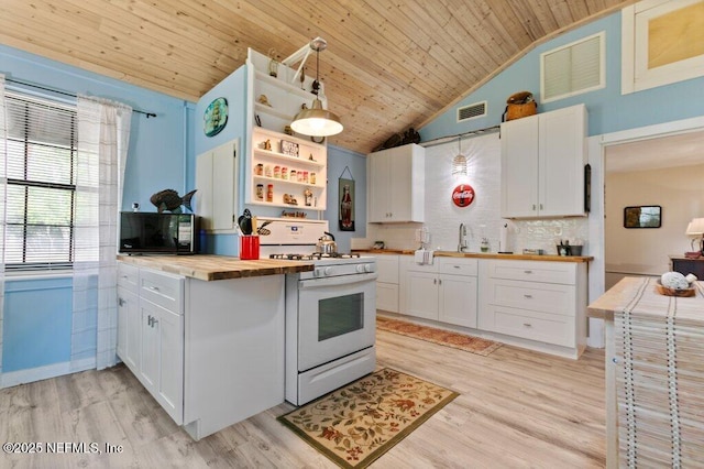 kitchen with open shelves, butcher block countertops, black microwave, wooden ceiling, and white gas range