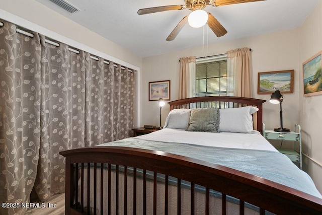 bedroom featuring visible vents and ceiling fan