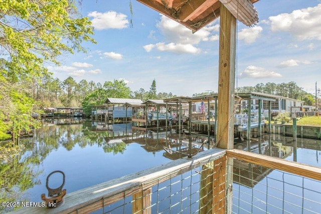 exterior space featuring boat lift and a dock