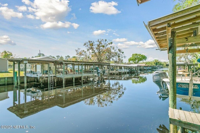 dock area featuring a water view and boat lift