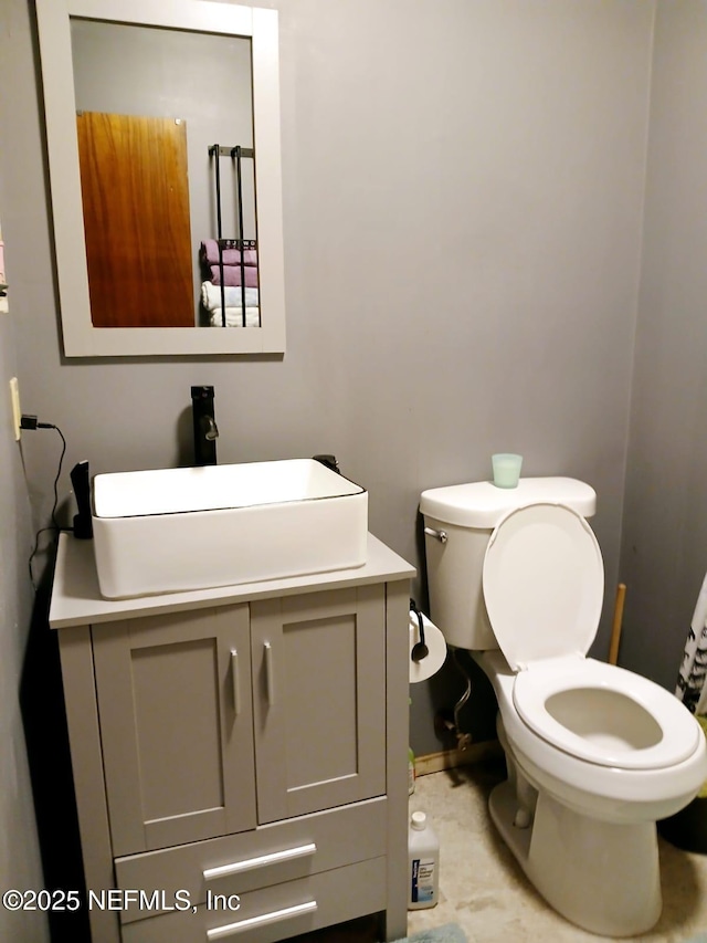 half bath with toilet and vanity