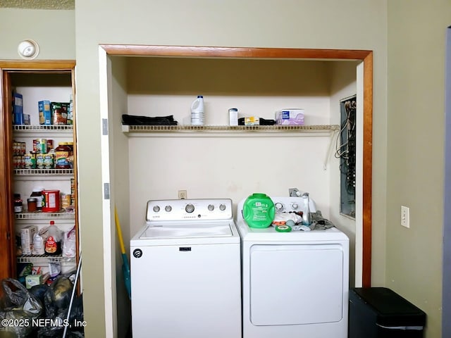 washroom with washer and dryer and laundry area