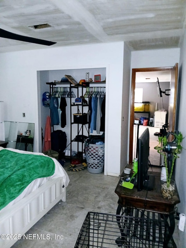 bedroom featuring concrete flooring