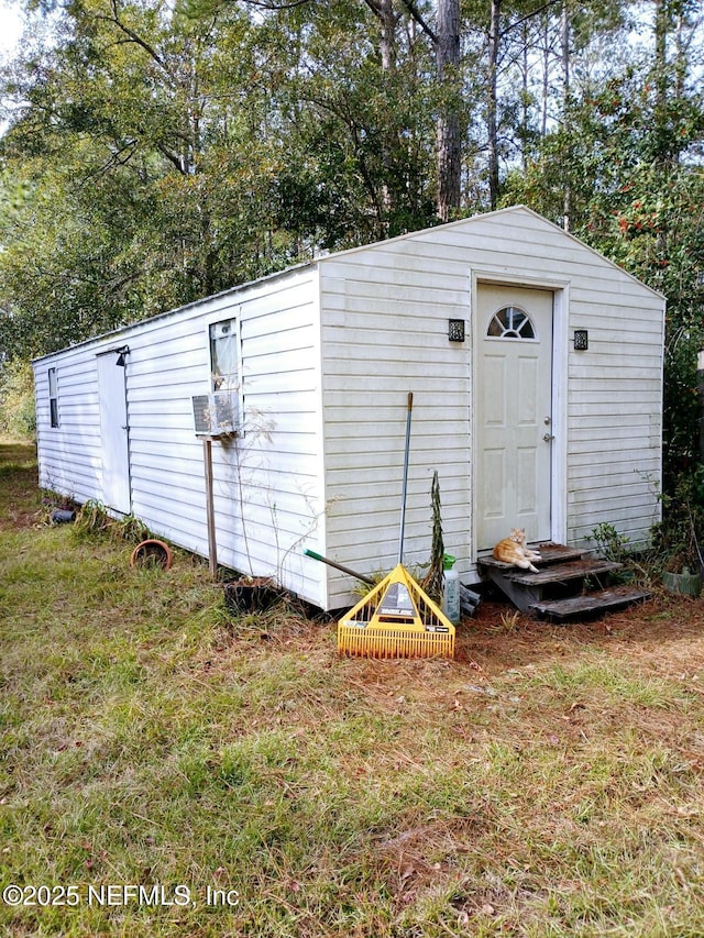 view of outdoor structure featuring entry steps and an outdoor structure