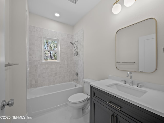 bathroom featuring visible vents, toilet, vanity, and bathtub / shower combination