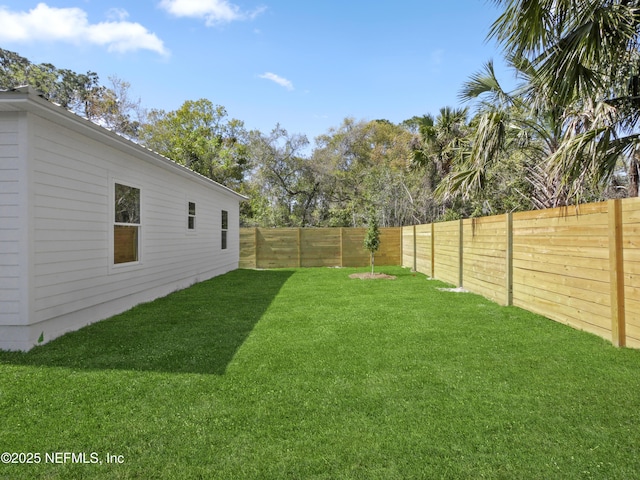 view of yard featuring a fenced backyard