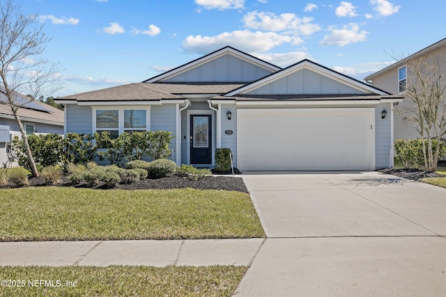 ranch-style house with a front yard, a garage, board and batten siding, and driveway