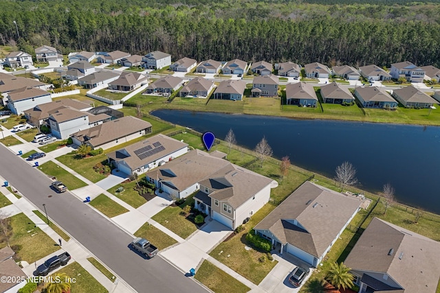 aerial view featuring a residential view and a water view