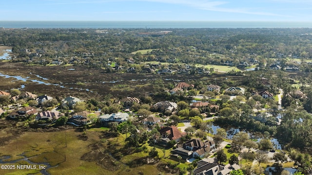 bird's eye view with a residential view and a water view