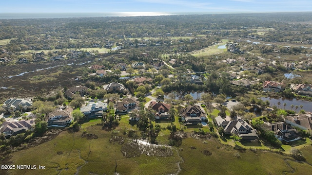 birds eye view of property featuring a residential view and a water view