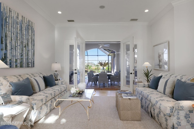 living room featuring recessed lighting, visible vents, and ornamental molding